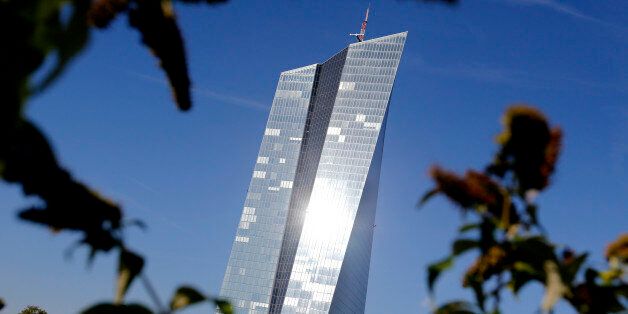 The headquarters of the European Central Bank is pictured through plants in Frankfurt, Germany, Wednesday, Sept. 7, 2016. The ECB will have its governing council meeting on Thursday. (AP Photo/Michael Probst)