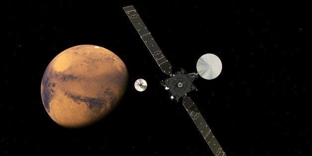 In this artist impression provided by the European Space Agency, ESA, the ExoMars Trace Gas Orbiter, TGO, right, and its entry, descent and landing demonstrator module, Schiaparelli, center, approaching Mars. The separation was scheduled to occur on Sunday Oct. 16, about seven months after launch. Schiaparelli is set to enter the martian atmosphere on Wednesday, Oct. 19, 2016 while TGO will enter orbit around Mars. The probe will take images of Mars and conduct scientific measurements on the surface, but its main purpose is to test technology for a future European Mars rover. Schiaparelli's mother ship will remain in orbit to analyze gases in the Martian atmosphere to help answer whether there is or was life on Mars. (ESA ATG/medialab via AP)