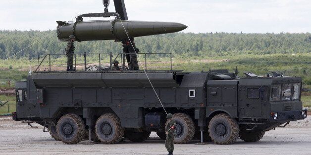 Russian servicemen equip an Iskander tactical missile system at the Army-2015 international military-technical forum in Kubinka, outside Moscow, Russia, June 17, 2015. REUTERS/Sergei Karpukhin