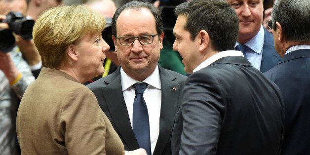 German Chancellor Angela Merkel, left, speaks with French President Francois Hollande, center, Greek Prime Minister Alexis Tsipras, third right, and British Prime Minister David Cameron, second right, during a round table meeting at an EU summit in Brussels on Thursday, Feb. 18, 2016. European Union leaders are holding a summit in Brussels on Thursday and Friday to hammer out a deal designed to keep Britain in the 28-nation bloc. (AP Photo/Geert Vanden Wijngaert)
