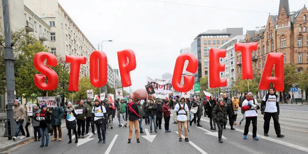 People march to protest against the planned CETA free trade agreement (Comprehensive Economic and Trade Agreement) between the European Union and Canada, and similar plans between EU and United States (TTIP) in Warsaw, Poland October 15, 2016. Agencja Gazeta/Kuba Atys/via REUTERS ATTENTION EDITORS - THIS IMAGE WAS PROVIDED BY A THIRD PARTY. EDITORIAL USE ONLY. POLAND OUT.