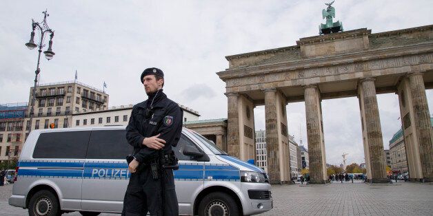 A policemen and plice car is pictured in front of Brandenburg Gate in Berlin, Germany on October 16, 2016. The area has been restricted to access due to the stay of Russian President Vladimir Putin in the close-by Hotel Adlon ahead of a meeting in the Normandy format with German Chancellor Angela Merkel, French President Francois Hollande and Ukrainian President Petro Poroshenko to discuss security in Ukraine and in Syria. (Photo by Emmanuele Contini/NurPhoto via Getty Images)