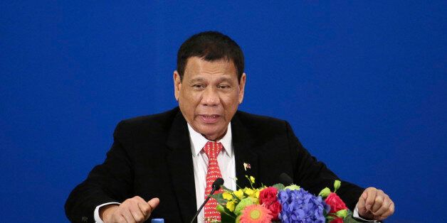 Philippine President Rodrigo Duterte delivers a speech during the Philippines-China Trade and Investment Forum at the Great Hall of the People in Beijing Thursday, Oct. 20, 2016. China and the Philippines have agreed to resume a dialogue on their dispute over the South China Sea, a senior Chinese diplomat said Thursday following talks between the countries' leaders. (Wu Hong/Pool Photo via AP)