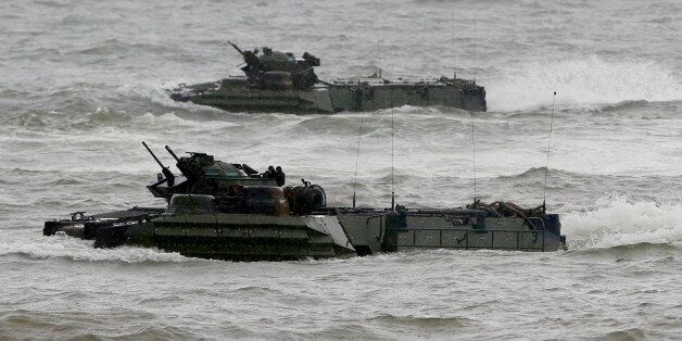 U.S. Marine Amphibious Assault Vehicles (AAV) manoeuvre in rough seas facing the South China Sea during the joint US-Philippines amphibious landing exercise dubbed PHIBLEX Friday Oct.7, 2016 at Naval Education Training Command in San Antonio township, Zambales province northwest of Manila, Philippines. The combat drill, however, maybe the last under President Rodrigo Duterte, who has opposed the war games partly because they may upset China and because of his disgust over U.S. criticisms of his bloody anti-drug campaign. (AP Photo/Bullit Marquez)