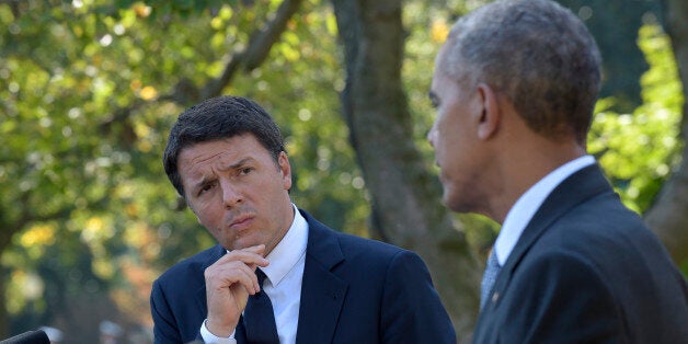 Italian Prime Minister Matteo Renzi listens as President Barack Obama speaks during their joint news conference in the Rose Garden of the White House in Washington, Tuesday, Oct. 18, 2016. (AP Photo/Susan Walsh)