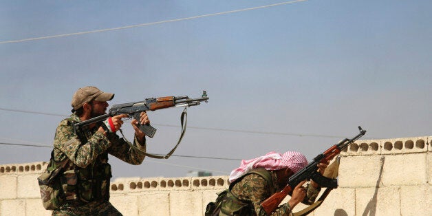 FILE - In this Oct. 11, 2015 file photo, Syrian soldiers fire repelling an attack in Achan, Hama province, Syria. he battle for Aleppo has gripped the world, but it is hardly the only front in Syria: Opposition forces are on the offensive in the countryâs center hoping to sever the road connection between Aleppo and the capital Damascus, which is itself a front; in the northwest, Turkish-backed opposition forces battle Islamic State militants; to the east, government forces weather an Islamic State siege of Deir El-Zour. (Alexander Kots/Komsomolskaya Pravda via AP, File)