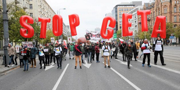People march to protest against the planned CETA free trade agreement (Comprehensive Economic and Trade Agreement) between the European Union and Canada, and similar plans between EU and United States (TTIP) in Warsaw, Poland October 15, 2016. Agencja Gazeta/Kuba Atys/via REUTERS ATTENTION EDITORS - THIS IMAGE WAS PROVIDED BY A THIRD PARTY. EDITORIAL USE ONLY. POLAND OUT.