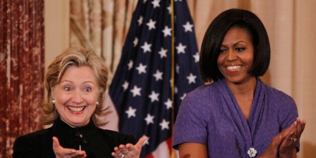 U.S. Secretary of State Hillary Clinton (L) and first lady Michelle Obama are pictured during the 2010 International Women of Courage Awards at the State Department in Washington, March 10, 2010. REUTERS/Jason Reed (UNITED STATES - Tags: POLITICS)
