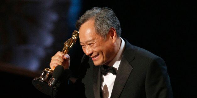 Director Ang Lee reacts after winning the Oscar for best director for
