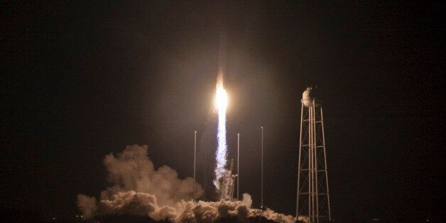 The Orbital ATK Antares rocket, with the Cygnus spacecraft onboard, launches from Pad-0A at NASA's Wallops Flight Facility in Wallops Island, Va., Monday, Oct. 17, 2016. Orbital ATK's sixth contracted cargo resupply mission with NASA to the International Space Station is delivering over 5,100 pounds of science and research, crew supplies and vehicle hardware to the orbital laboratory and its crew. (Bill Ingalls/NASA via AP)