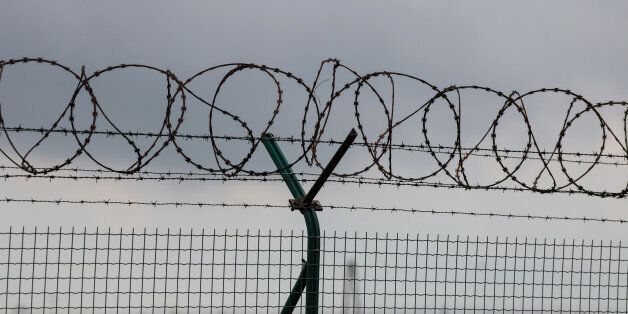 Barbed wire fence of a restricted area (Warsaw Chopin Airport, Poland)