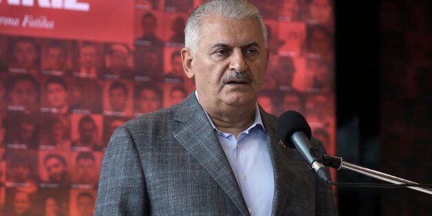 Turkish Prime Minister Binali Yildirim speaks in Istanbul, Sunday, Oct. 9, 2016. Kurdish militants detonated a car bomb Sunday outside a military checkpoint in southeast Turkey, killing ten soldiers and eight civilians,Yildirim said. Turkey immediately launched a military operation against the militants in response.