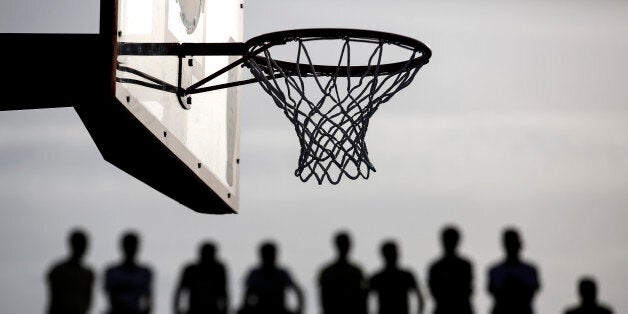 Spectators watch a friendly basketball game in Athens, on Sunday, May 29, 2016. Latvian New York Knicks star Kristaps Porzingis joined fellow NBA player Giannis Antetokounmpo, of the Milwaukee Bucks, and his older brother Thanasis, for a game of streetball Sunday. The