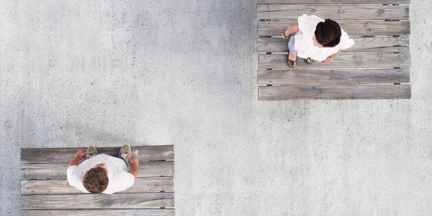 Couple standing on wooden docks