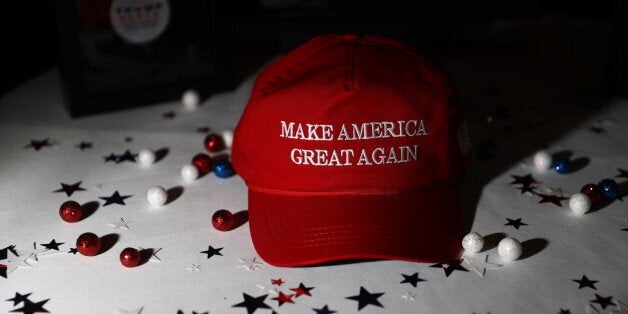 A 'Make America Great Again' hat sits on a table ahead of an election night party for 2016 Republican Presidential Nominee Donald Trump at the Hilton Midtown hotel in New York, U.S., on Tuesday, Nov. 8, 2016. Fifty-one percent of voters nationally were bothered a lot by Trump's treatment of women, while Democrat Hillary Clinton's use of private e-mail while secretary of state was troubling to 44 percent, according to preliminary exit polling as voting neared a close in some states. Photographer: Andrew Harrer/Bloomberg via Getty Images