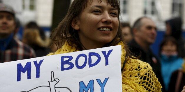 Woman holds a placard as she demonstrates against plans of tightening the abortion law in Warsaw, Poland April 9, 2016. REUTERS/Kacper Pempel