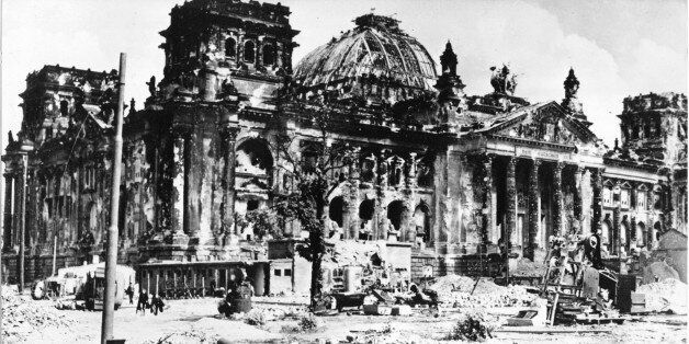 The wrecked Berlin Reichstag building pictured at the end of World War II following heavy fightings. In foreground German military vehicle. Undated picture. (AP Photo)