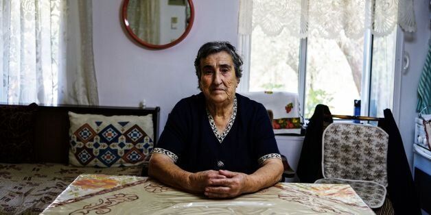 TOPSHOT - Emilia Kamvisi, 86, a Nobel Peace Prize nominee, poses inside her house at the Skala Sikamias village on the island of Lesbos on October 5, 2016. This year, the Norwegian Nobel Institute has received a whopping 376 nominations for the peace prize, a huge increase from the previous record of 278 in 2014 -- meaning the number of choices facing the Nobel committee is vast. Greek islanders are among the contenders for their efforts to help desperate migrants landing on their shores. / AFP / Angelos Tzortzinis (Photo credit should read ANGELOS TZORTZINIS/AFP/Getty Images)