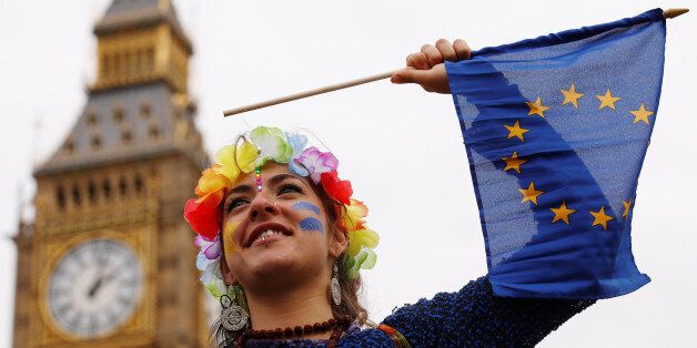 A Pro-Europe demonstrator waves a flag during a