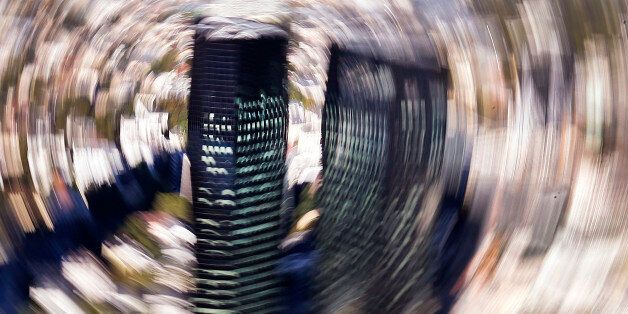 The photo taken with the camera rotated during a long exposure shows headquarters of Deutsche Bank in Frankfurt, Germany, Wednesday, Oct. 5, 2016. (AP Photo/Michael Probst)