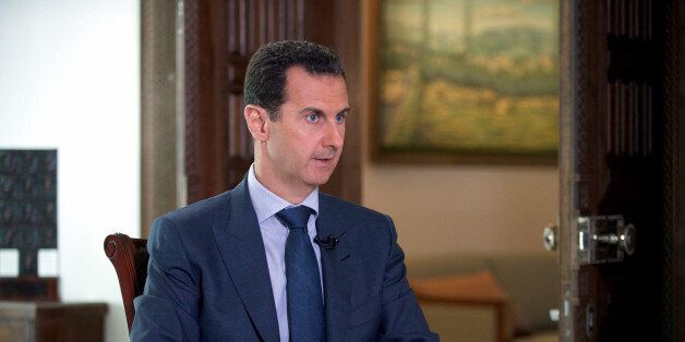 In this Wednesday, Sept. 21, 2016 photo released by the Syrian Presidency, Syrian President Bashar Assad speaks to The Associated Press at the presidential palace in Damascus, Syria. Assad said U.S. airstrikes on Syrian troops in the countryâs east were âdefinitely intentional,â lasting for an hour, and blamed the U.S. for the collapse of a cease-fire deal brokered with Russia. In the interview with the AP, Assad said the war, now in its sixth year, is likely to âdrag onâ because of what he said was continued external support for his opponents.(Syrian Presidency via AP)