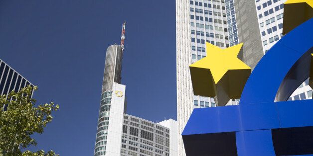 The Commerzbank AG headquarters, center, stands behind the euro sign sculpture in Frankfurt, Germany, on Thursday, Sept. 29, 2016. Commerzbank AG Chief Executive Officer Martin Zielke plans to reduce about one in five jobs, suspend dividends and shrink securities trading in the biggest overhaul since the German lenders bailout. Photographer: Martin Leissl/Bloomberg via Getty Images