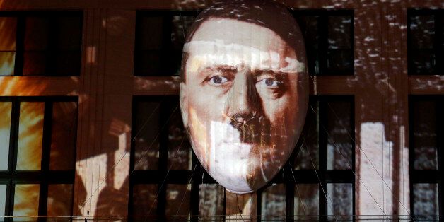 The face of Adolf Hitler is projected onto a 3D canvas as part of an art installation during a rehearsal for the 'Berlin Leuchtet' (Berlin shines) festival in Berlin, Germany, Thursday, Sept. 29, 2016. 'Berlin Leuchtet' takes place from Sept. 30 until Oct. 16, 2016 in the German capital. (AP Photo/Michael Sohn)