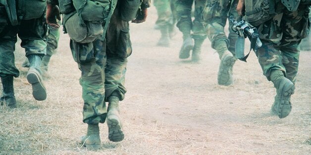 Soldiers marching in desert