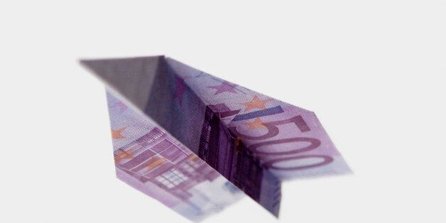 A five hundred euro banknote folded into a paper airplane