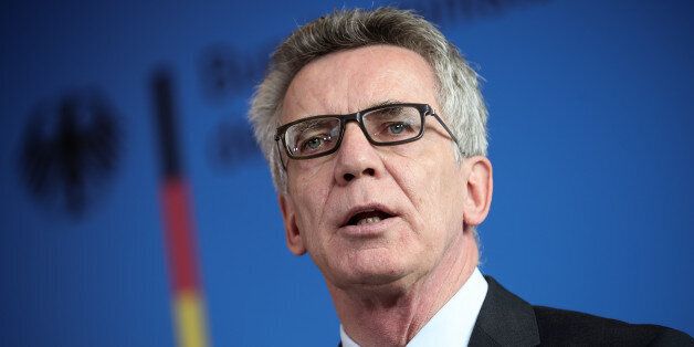 German Interior Minister Thomas de Maiziere delivers a statement in Berlin, Tuesday Sept. 13, 2016. Germanyâs interior minister says three Syrian men believed to have been sent to Germany by the Islamic State group appear to have used the same smugglers and received passports from the same workshop as some of those involved in the Paris attacks. The three men were arrested in northern Germany on Tuesday. Interior Minister Thomas de Maiziere said they had been under observation for months and there were no indications of any concrete plans for an attack. ( Michael Kappeler/dpa via AP)