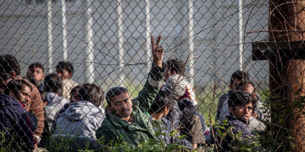 MORIA, GREECE-- Pakistan men hold a hunger strike sit in protest at Moria Camp, a detention center for immigrants on the Greek island of Lesbos on April 7, 2016. Without a basis for asylum, hundreds of Pakistanis are trapped on the Greek islands, especially Lesbos and Chios. Greece began deported immigrants to Turkey earlier in the week. (Photo by Jodi Hilton/NurPhoto via Getty Images)