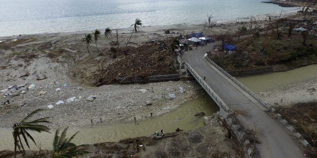 Aerial picture showing the destruction caused by Hurricane Matthew in Port-Salut, southwest of Port-au-Prince, on October 9, 2016, days after the passage of the hurricane through Haiti.Haiti began three days of mourning on Sunday for hundreds killed in Hurricane Matthew as relief officials grappled with the unfolding devastation in the Caribbean country's hard-hit south. And nearly a week after being devastated by the hurricane, Haiti is confronted with a growing cholera outbreak threatening to turn its disaster even more deadly. / AFP / Nicolas GARCIA (Photo credit should read NICOLAS GARCIA/AFP/Getty Images)