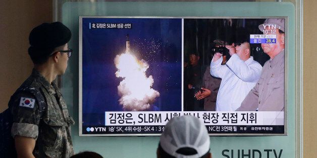 FILE - In this Thursday, Aug. 25, 2016, file photo, a South Korean army soldier watches a TV news program showing images published in North Korea's Rodong Sinmun newspaper of North Korea's ballistic missile believed to have been launched from underwater and North Korean leader Kim Jong-un, at Seoul Railway station in Seoul, South Korea. North Koreaâs torrent of weapons tests in 2016 has strengthened Pyongyang militarily, but the real reason behind the rush is the U.S. presidential elections, according to a growing number of experts on North Korea. Kim Jong Un has forged an increasingly sophisticated arsenal. There have been truck-launched missile tests, two nuclear explosions, experiments with powerful rocket engines and more than a dozen other major missile trials. (AP Photo/Ahn Young-joon, File)