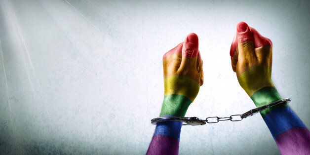 handcuffed hands - discrimination concept
