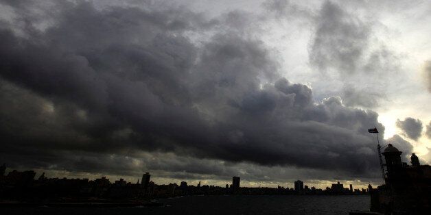 Storm clouds are seen over the skyline of Havana September 29, 2010. Short-lived Tropical Storm Nicole triggered flash flooding that killed eight people in Jamaica and dumped heavy rain on Florida, Cuba, the Cayman Islands and the Bahamas on Wednesday. Cuban forecasters put the top winds at 37 mph (59 kph) and disagreed that it was a tropical storm when it crossed the island.
