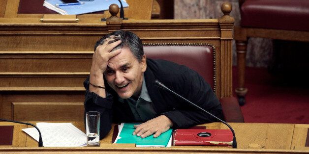 Greek Finance Minister Euclid Tsakalotos reacts during a parliamentary session before a vote of an omnibus bill cutting spending on pensions, speed up privatisations and reform the electricity market, in Athens, Greece, September 27, 2016. REUTERS/Alkis Konstantinidis