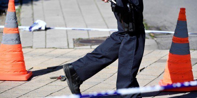 A security perimeter has been set around n the scene where two police officers were stabbed on October 5, 2016 in the Schaerbeek neighbourhood in Brussels. / AFP / BELGA / DIRK WAEM / Belgium OUT (Photo credit should read DIRK WAEM/AFP/Getty Images)