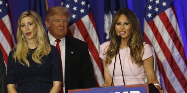Melania Trump, right, speaks as her husband Donald Trump, president and chief executive of Trump Organization Inc. and 2016 Republican Presidential candidate, center, and daughter Ivanka Trump, listen during a South Carolina primary night rally in Spartanburg, South Carolina, U.S., on Saturday, Feb. 20, 2016. Trump, the brash New York billionaire who has upended all the rules of modern campaigning, won Saturday's South Carolina primary in a decisive fashion that shrinks the prospects of his Republican presidential rivals to stop his march to the nomination. Photographer: Luke Sharrett/Bloomberg via Getty Images