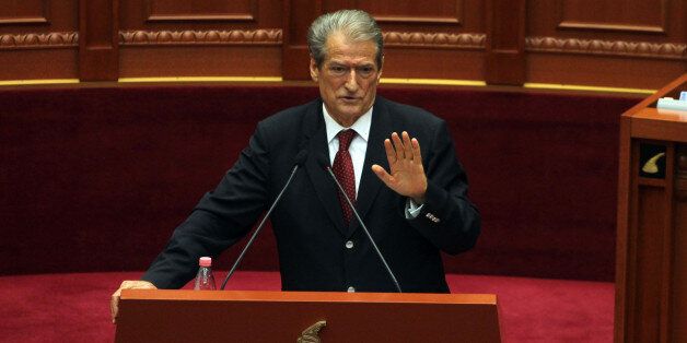 Former Albanian prime minister Sali Berisha speaks at Parliament in Tirana, Albania, Thursday April 21, 2016. Berisha, has called on Albanians to arm themselves because the government is failing to confront crime. Gun ownership is illegal in Albania and calls to break the law could result in a 10-year jail sentence. (AP Photo/Hektor Pustina)