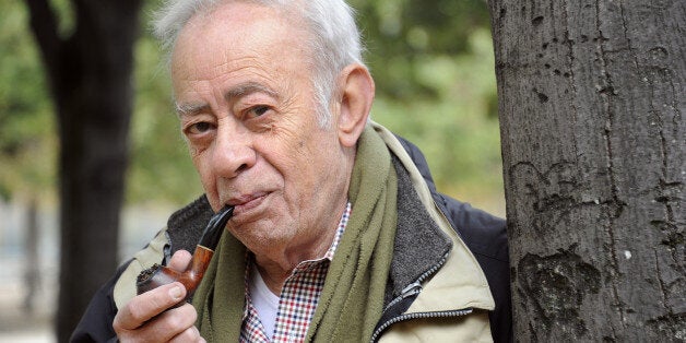 Greek writer Vassilis Alexakis smokes his pipe as he poses on October 29, 2012 in Paris. AFP PHOTO BERTRAND GUAY (Photo credit should read BERTRAND GUAY/AFP/Getty Images)