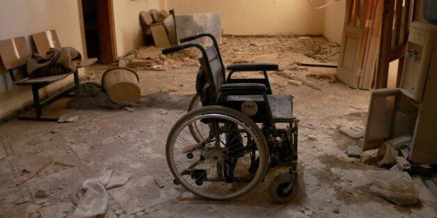 ALEPPO, SYRIA - OCTOBER 01: An unusable wheel chair is seen inside the Sahra Hospital after a barrel bomb strike by Syrian regime forces over Sahur neighborhood of Aleppo, Syria on October 01, 2016. (Photo by Jawad Al-Rifai/Anadolu Agency/Getty Images)