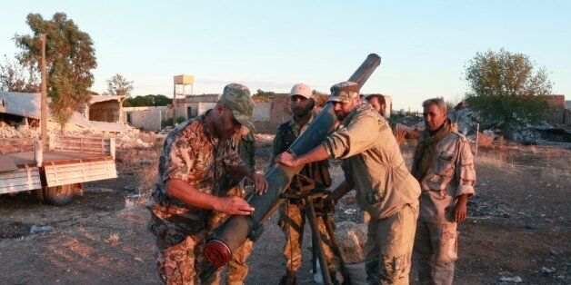 ALEPPO, SYRIA - SEPTEMBER 22: Free Syrian Army (FSA) Sultan Murad Brigade members make their last preparation before they launch rocket attack to terrorist organization Daesh positions near the Turkmen Barih villagen in Azaz town of Aleppo, Syria on September 22, 2016. (Photo by Majd Al Halebi/Anadolu Agency/Getty Images)