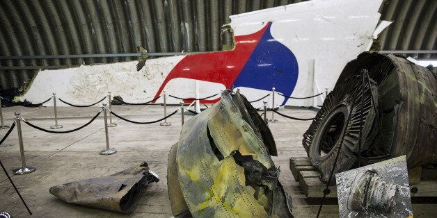 Wreckage of the MH17 airplane is seen after the presentation of the final report into the crash of July 2014 of Malaysia Airlines flight MH17 over Ukraine, in Gilze Rijen, the Netherlands, October 13, 2015. Malaysian Airlines Flight 17 was shot down over eastern Ukraine by a Russian-made Buk missile, the Dutch Safety Board said on Tuesday in its final report on the July 2014 crash that killed all 298 aboard. The long-awaited findings of the board, which was not empowered to address questions of responsibility, did not specify who launched the missile. REUTERS/Michael Kooren