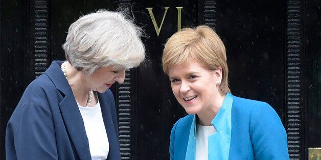 Britain's new Prime Minister Theresa May (L) is greeted by Scotland's First Minister Nicola Sturgeon (R) leaves Bute House, in Edinburgh, on July 15, 2016 after a visit to hold talks with . Theresa May visited Scotland for talks with the First Minister less than 48 hours after taking office as British prime minister. / AFP / Lesley Martin (Photo credit should read LESLEY MARTIN/AFP/Getty Images)