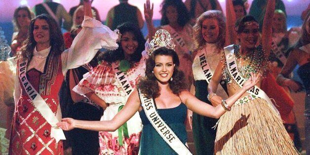 The 1996 reigning Miss Universe, Alicia Machado of Venezuela, joins in the opening number during the 1997 Miss Universe Pageant in Miami Beach Friday, May 16, 1997. (AP Photo/Hans Deryk)