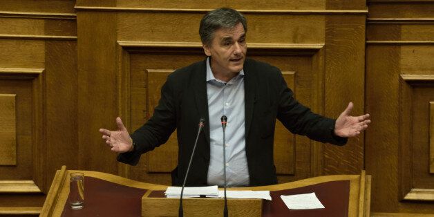 HELLENIC PARLIAMENT, ATHENS, ATTIKI, GREECE - 2016/07/26: Minister of Economics Euclid Tsakalotos during his speech in Hellenic Parliament. The proposal of the New Democracy party for a committee that will investigate the first six months of the government Syriza - Anel, which includes the famous Â«plan xÂ» and the former Minister of Economics Yanis Varoufakis and how Greece was lead in the third memorandum was voted today in Hellenic Parliament. The proposal was rejected by the ruling major