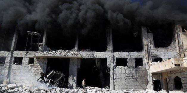 ALEPPO, SYRIA - SEPTEMBER 24: Smoke rises after Russian airstrikes hit a thread factory in al-Qasimiye neighborhood of Aleppo, Syria on September 24, 2016 (Photo by Beha el Halebi/Anadolu Agency/Getty Images)