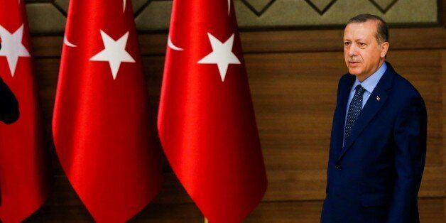 ANKARA, TURKEY - SEPTEMBER 29: President of Turkey Recep Tayyip Erdogan walks to give a speech during 27th 'Mukhtars (local administrators) meeting' at Presidential Complex in Ankara, Turkey on September 29, 2016. (Photo by Ahmet Izgi/Anadolu Agency/Getty Images)