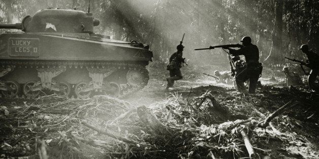 Side profile of army soldiers with a military tank in a forest, Battle of Bougainville, US Military, Bougainville Island, World War II