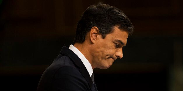 Socialist party leader Pedro Sanchez looks down as he addresses lawmakers during the second day of the two-day investiture debate at the Spanish parliament in Madrid, Wednesday, Aug. 31, 2016. Spain's acting Prime Minister Mariano Rajoy opened a two-day parliamentary debate on Tuesday in hopes of forming a new government and ending an eight-month impasse, but expectations of a breakthrough are running low. and Popular party leader. (AP Photo/Francisco Seco)
